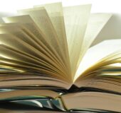 A book that is opened with the pages turning